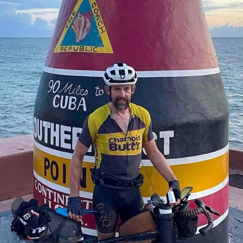 Eddie with his loaded bike at the Southernmost Point buoy in Key West